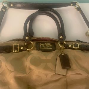 Tan cloth bag coach